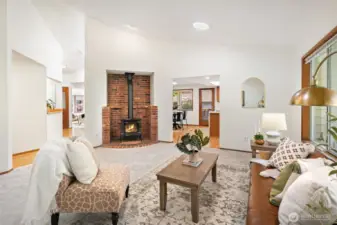 The inviting secondary living room, complete with a warm fireplace, offers a cozy retreat for quiet evenings in.