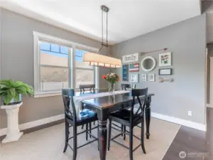 Dining Area with a View – Picture-perfect dining with expansive backyard and mountain vistas.