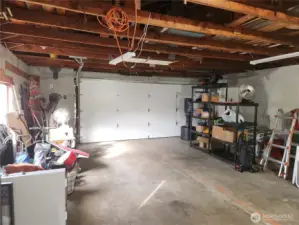 Garage view has plenty of room for two cars and work space.