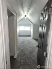 Enter into the upstairs bedroom, closet is directly to the left.