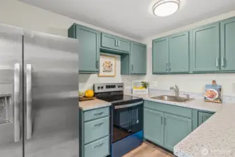 Kitchen with brand new stainless steel appliances and quartz countertops!