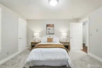 Bedroom with washer and dryer