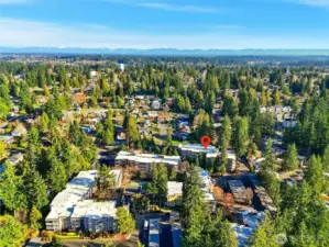 Ground-floor end unit in a serene, park-like setting w/easy access & a relaxed, retreat-style feel