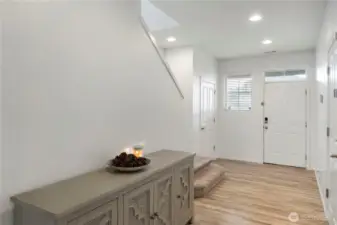 Step inside to a bright and inviting entryway that immediately feels warm, open, and thoughtfully designed.