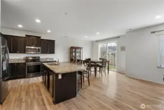 Large kitchen island provides the perfect hub for casual dining, meal prep, or hosting guests.