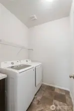 Main floor spacious laundry room.