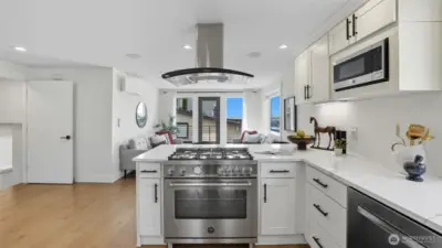 The kitchen invites you to indulge your culinary creativity. Stainless steel appliances compliment the expansive counter space.