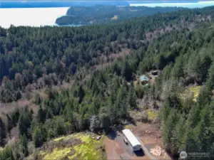 The property is located between the 2 homes and a short distance to Pleasant Harbor below. A public boat launch is located there for easy Hood Canal water access.