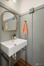 Powder room tucked away on the main floor for convenience when hosting!