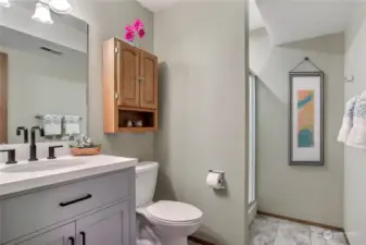 Lower level 3/4 bath. Digitally staged.