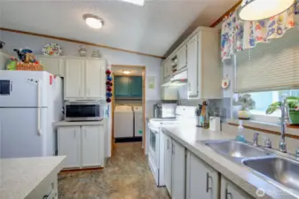 Looking from the kitchen into the laundry area.