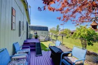 Deck area with room for seating and bbq.
