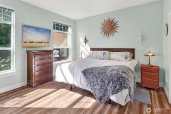 The primary suite is your own oasis with updated flooring.