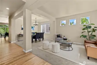 Located in the highly sought-after LaGrande Station community in Puyallup, WA, this open-concept formal living and dining area offers timeless style and comfort. The front sitting room features a series of upper accent windows and a large picture window facing Chateau Dr, welcoming natural light and curbside views. Just off the entry, the dining area is perfectly positioned for entertaining, complete with crown molding and modern lighting. Hardwood flooring transitions into plush carpet for a warm, inviting feel. With convenient access to shopping, parks, top-rated schools, and transit, this home combines lifestyle and location effortlessly.