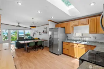 Big open kitchen has cabinets that can roll into being kitchen islands to increase your prep space.