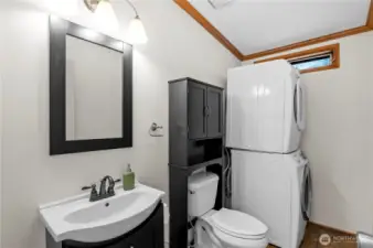 Guest half bath. You could also move the washer/dryer to the hall closet and replace them with a shower if you don't want to share...