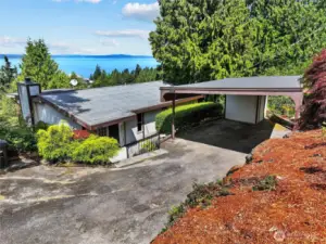Entrance to home with 2 car covered carport.