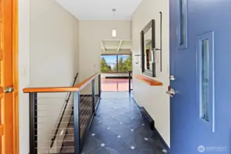 Front door entry to the living room and kitchen.  The entrance, living room and kitchen all flow as one.
