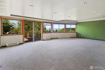 Large basement room.  Lots of space for hanging out, entertaining, or use as a media room while enjoying the view.  Deck off this room as well!