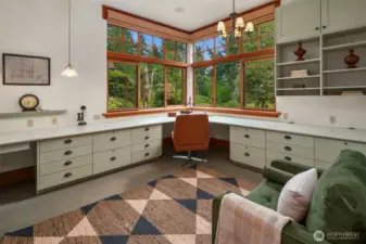 Spacious office off of living room with built-ins, propane fireplace and calming views of the landscape and forest