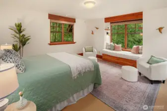 Bedroom on upper level with built-in window seat and delightful tree-top views overlooking the Quaking Aspen grove