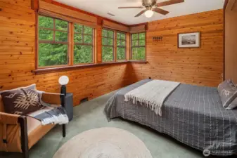 Formerly a sleeping porch off of primary bedroom, this inviting room has a Murphy bed and also overlooks the quaking aspen grove