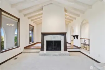 Amazing fireplace and vaulted beam ceiling in the living room