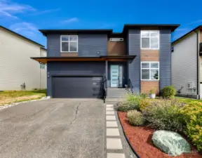 Immaculate newer construction home with beautiful landscaping.