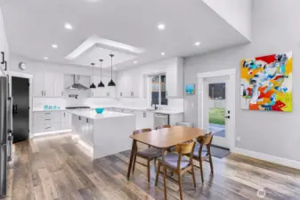 Dining space with exterior door to the back porch and large fenced back yard.
