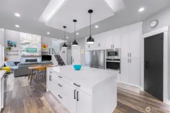 Large side by side fridge and freezer, wall oven, wall microwave and corner pantry
