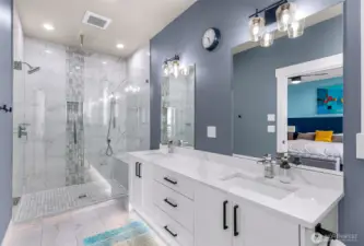 Primary bathroom with large walk in shower and double vanity