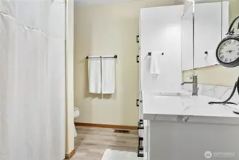 Guest full bath. Recently updated with quartz counter, new cabinets & more