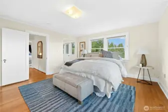 This image shows a walk-in wardrobe and door leading to a private balcony.