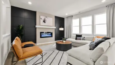 Spacious family room with electric fireplace, wired for TV above the mantel, and tremendous sunlight!  Picture for representational purposes only, colors and features may vary.