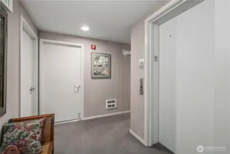 Lobby area with stairwell and elevator