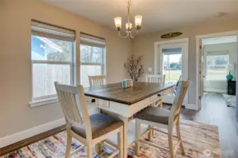 Cute farmhouse dining table has drawers under each side.