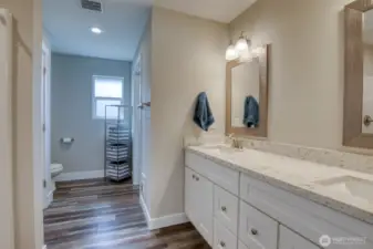 Large primary en-suite. Double sinks, quartz countertops, shower, walk-in closet.