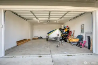 Boat does not convey. Lots of room in this 2 car garage.