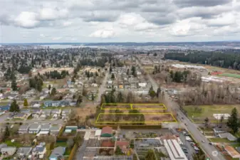 To the north (top of photo) is the Port of Tacoma.  On the right (east) is First Creek Middle School and the Eastside Community Center.