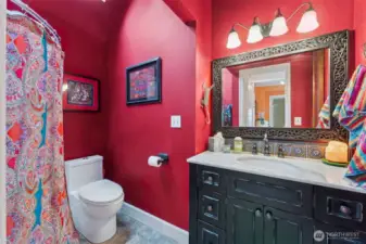 Main floor bath with vaulted ceiling and shower.