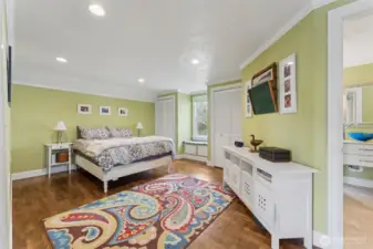 Primary bedroom upstairs is very spacious and features a window seat plus another small sitting area