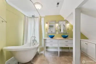 Primary ensuite bath with clawfoot tub/shower and double vanity