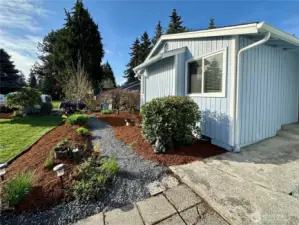 11704 132nd Ave Ct E with established landscaping, garden boxes, patios, decks, and a fenced back yard, plus gated side yard so you have multiple outdoor living spaces.