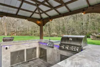 New, covered and lighted outdoor kitchen.