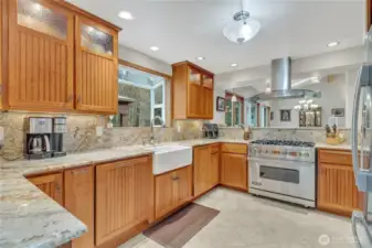 Chef's kitchen with Viking range, farm sink, custom cabinets and granite counter tops.