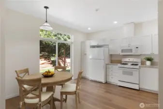 Enjoy a lovely view of trees, back patio and yard.