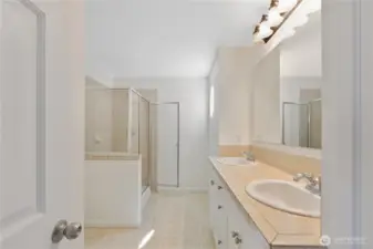 Primary ensuite bath w/ freshly painted cabinets.