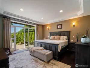 The primary bedroom suite enjoys beautiful views of the lake!