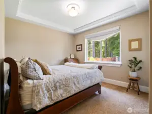 The second bedroom enjoys views of the lake.