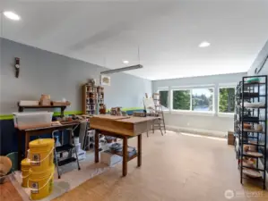 The extra finished room is currently being used as an art studio and has the beautiful backdrop of Munn Lake through the window.